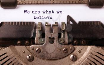 Vintage inscription made by old typewriter, we are what we believe