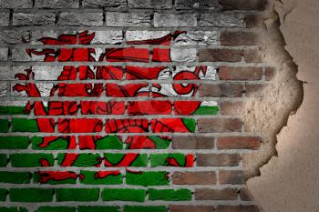Dark brick wall texture with plaster - flag painted on wall - Wales