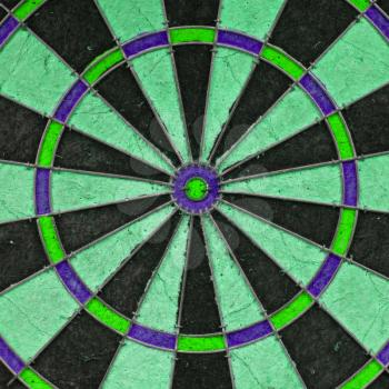 Close-up of a very old unique dartboard, isolated