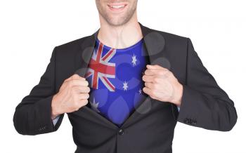 Businessman opening suit to reveal shirt with flag, Australia