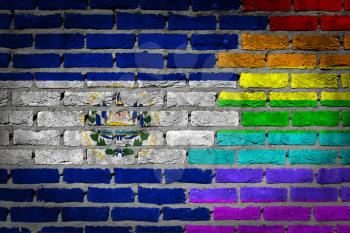 Dark brick wall texture - coutry flag and rainbow flag painted on wall - El Salvador
