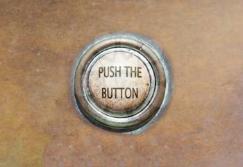 Grunge image of an old button - push the button