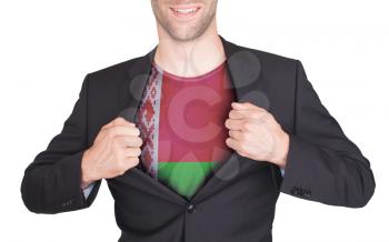 Businessman opening suit to reveal shirt with flag, Belarus