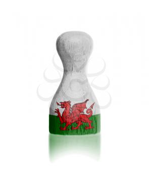 Wooden pawn with a painting of a flag, Wales