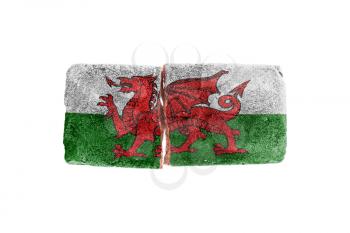 Rough broken brick, isolated on white background, flag of Wales