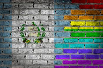 Dark brick wall texture - coutry flag and rainbow flag painted on wall - Guatemala