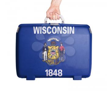 Used plastic suitcase with stains and scratches, printed with flag, Wisconsin