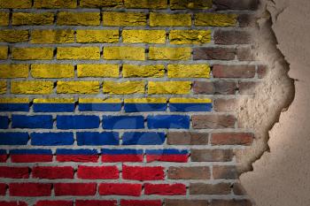 Dark brick wall texture with plaster - flag painted on wall - Colombia