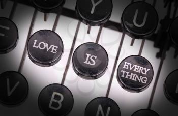 Typewriter with special buttons, love is everything