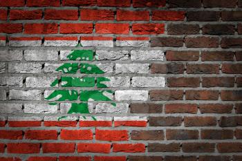 Very old dark red brick wall texture with flag - Lebanon