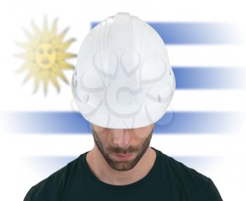 Isolated engineer with flag on background - Uruguay