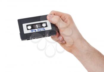 Vintage audio cassette tape, isolated on white background, 70's hits
