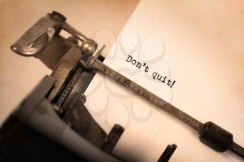 Vintage typewriter close-up - Don't Quit determination message
