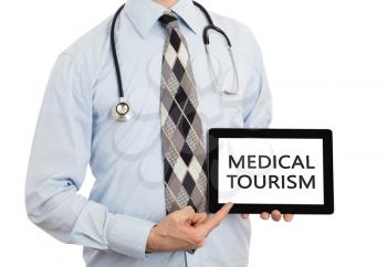 Doctor, isolated on white backgroun,  holding digital tablet - Medical tourism