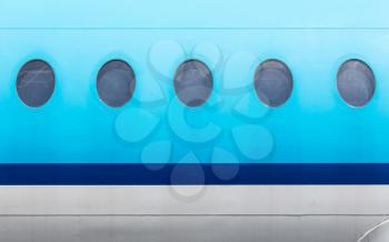 Windows of the blue airplane - copy space