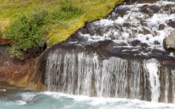 Hraunfossar waterfalls and cascade, a popular tourist destination in western Iceland