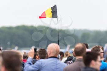 LEEUWARDEN, THE NETHERLANDS - JUNE 11, 2016: Belgium flag waving high above the public during the open days of the dutch air force at Leeuwarden, the Netherlands on june 11, 2016.