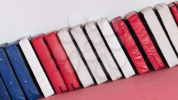 Large punching pads in a row, red white and blue