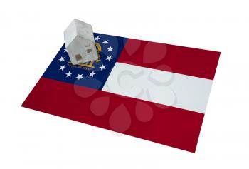 Small house on a flag - Living or migrating to Georgia