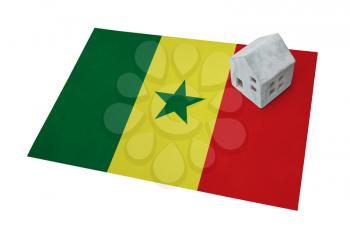 Small house on a flag - Living or migrating to Senegal
