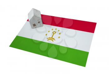 Small house on a flag - Living or migrating to Tajikistan