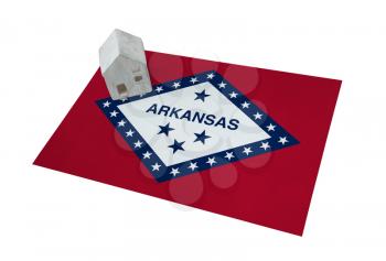 Small house on a flag - Living or migrating to Arkansas