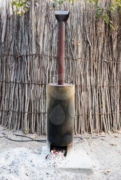 Private boiler for a shower in a campsite, Namibia