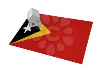 Small house on a flag - Living or migrating to East Timor