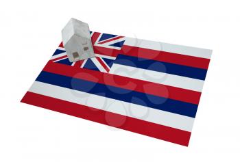 Small house on a flag - Living or migrating to Hawaii