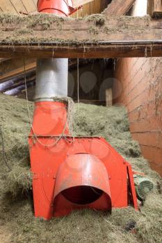 Machine for making hay bales, barn in Austria