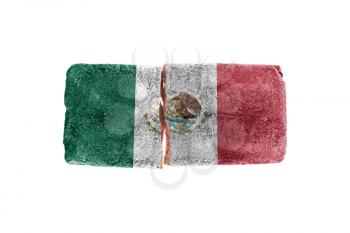 Brick with broken glass, violence concept, flag of Mexico