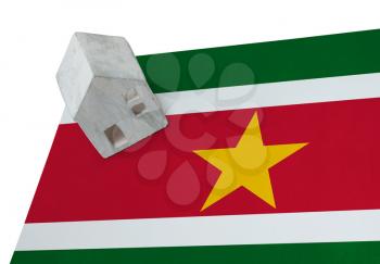 Small house on a flag - Living or migrating to Suriname