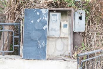 Old electricity meter in a village in Greece