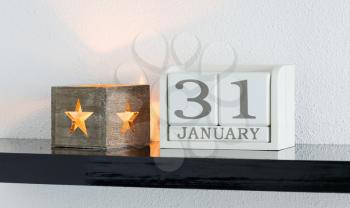 White block calendar present date 31 and month January on white wall background