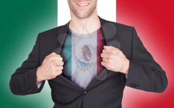 Businessman opening suit to reveal shirt with flag, Mexico