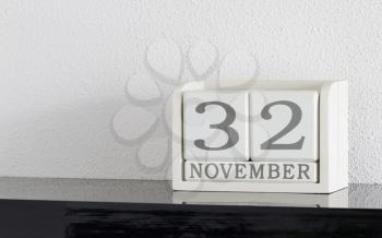 White block calendar present date 32 and month November on white wall background - Extra day