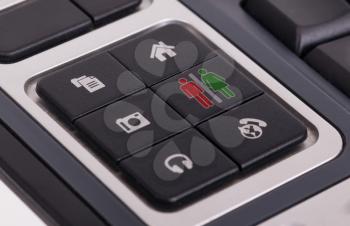 Buttons on a keyboard, selective focus on the middle right button - Man and woman