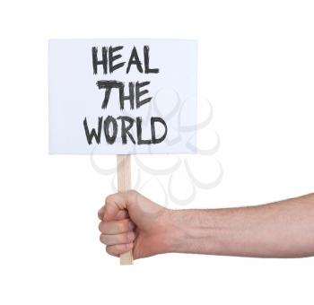 Hand holding sign, isolated on white - Heal the world