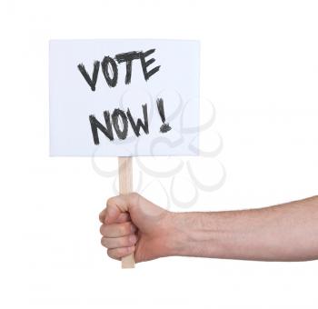 Hand holding sign, isolated on white - Vote now