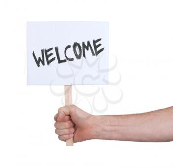 Hand holding sign, isolated on white - Welcome