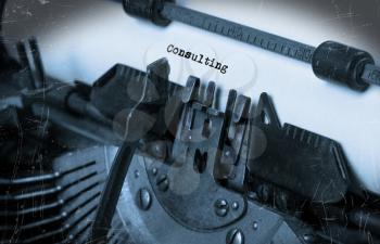 Close-up of an old typewriter with paper, perspective, selective focus, consulting
