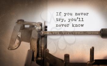 Vintage inscription made by old typewriter, If you never try, you'll never know