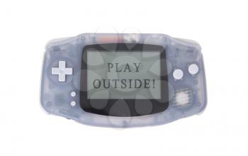 Old dirty portable game console with a small screen - play outside