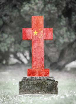 Old weathered gravestone in the cemetery - China