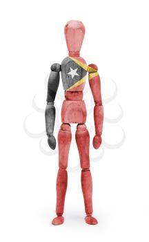 Wood figure mannequin with flag bodypaint on white background - East Timor