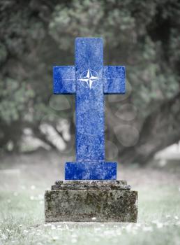 Old weathered gravestone in the cemetery - NATO