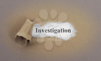 Text appearing behind torn brown envelop - Investigation