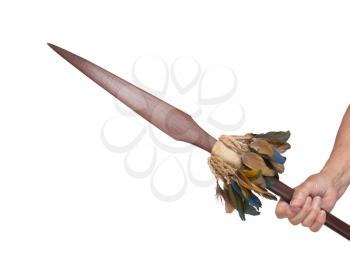 Old hand hodling an old wooden spear, isolated on white