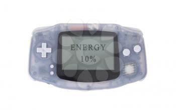 Old dirty portable game console with a small screen - energy at 10 percent