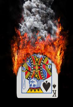 Playing card with fire and smoke, isolated on white - King of spades